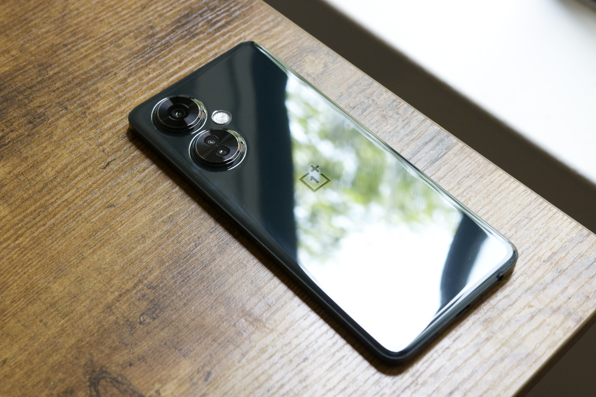 The OnePlus Nord N30 5G lying face-down on a desk.