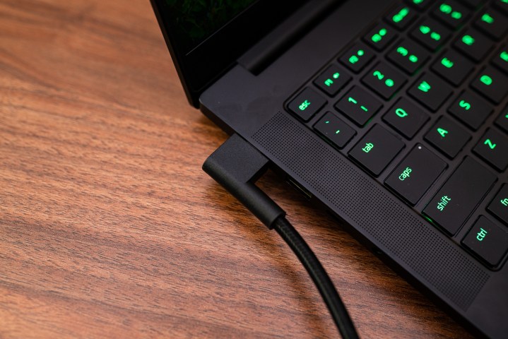 The power adapter plugged into the Razer Blade 14.