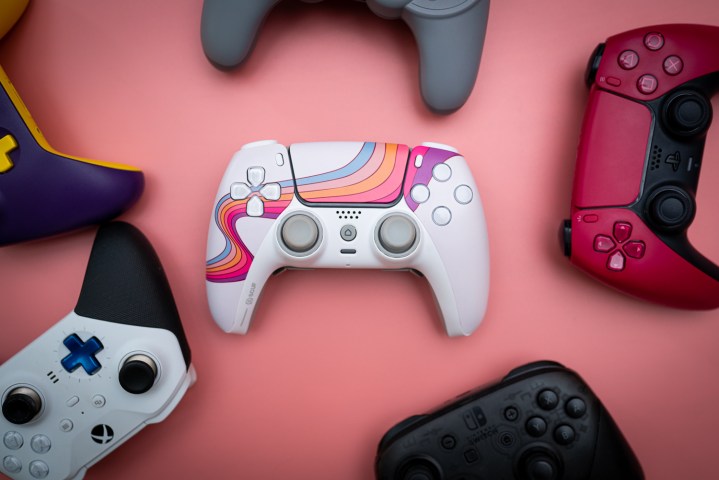 The Scuf Reflex controller sitting among several other controllers.