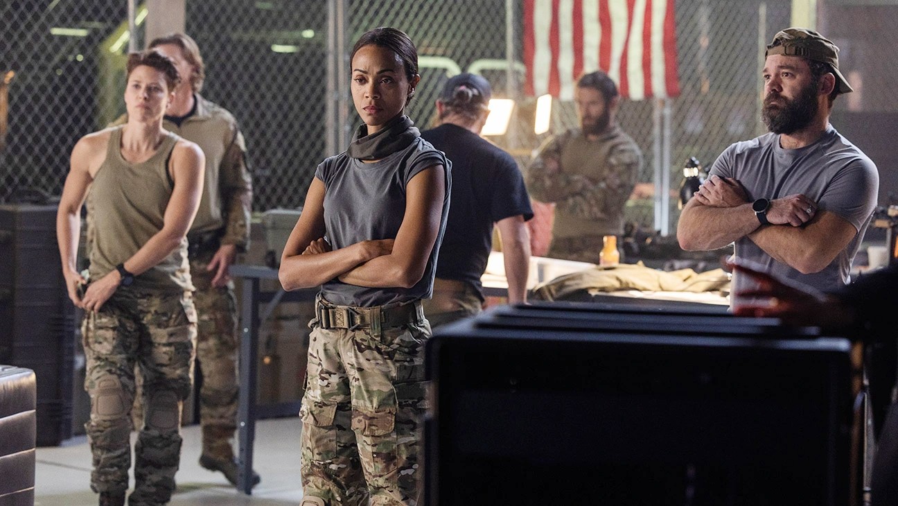 Zoe Saldana stands with a group of men in Special Ops: Lioness.