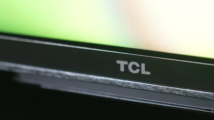 The bottom bezel and logo on a TCL QM8.