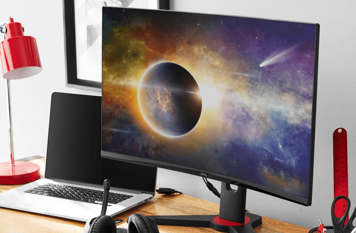 The Onn. 27-inch QHD curved gaming monitor with an eclipse on the screen.