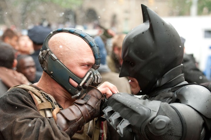 Bane and Batman stare each other down in The Dark Knight Rises.