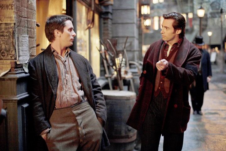 Christian Bale and Hugh Jackman look at each other in The Prestige.