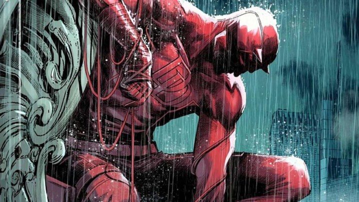 Daredevil brooding on a building as the rain pours.