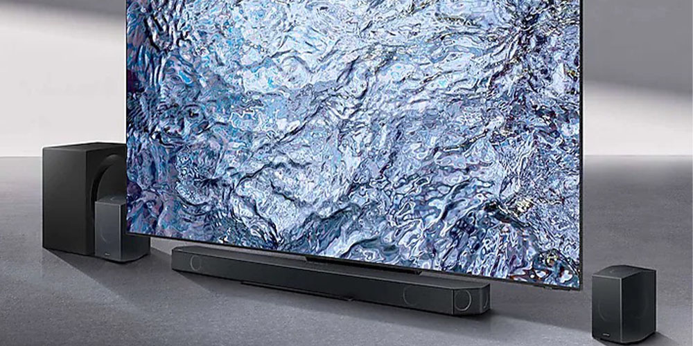 The Samsung Q-Series 11.1.4 channel wireless Dolby Atmos soundbar under a TV.