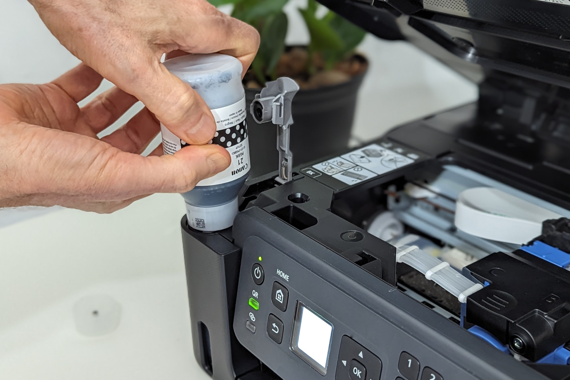The instructions say squeeze the Pixma G4270 ink bottles, but you can't.