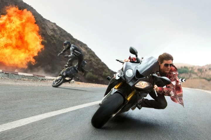 Tom Cruise drives a motorcycle in Mission: Impossible - Rogue Nation.