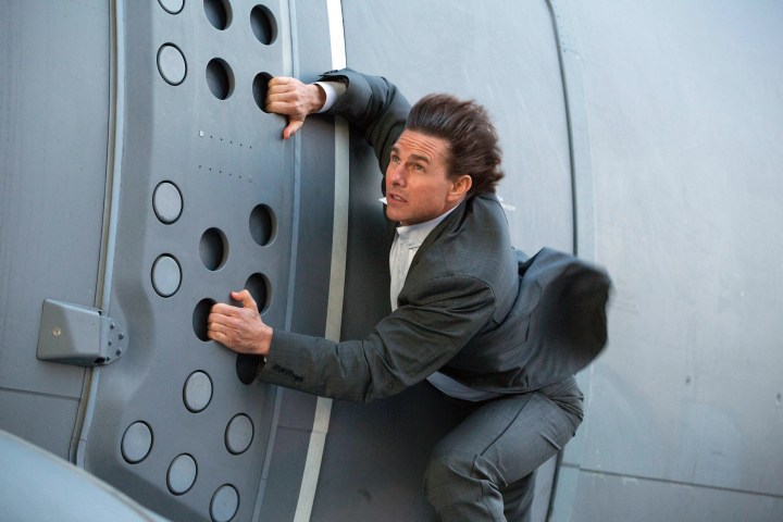 Tom Cruise holds onto a cargo plane in Mission: Impossible - Rogue Nation.