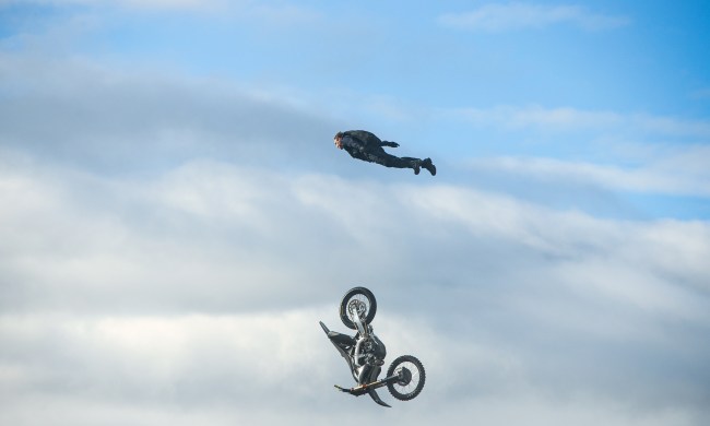 Tom Cruise soars above a falling motorcycle in Mission: Impossible - Dead Reckoning Part One.