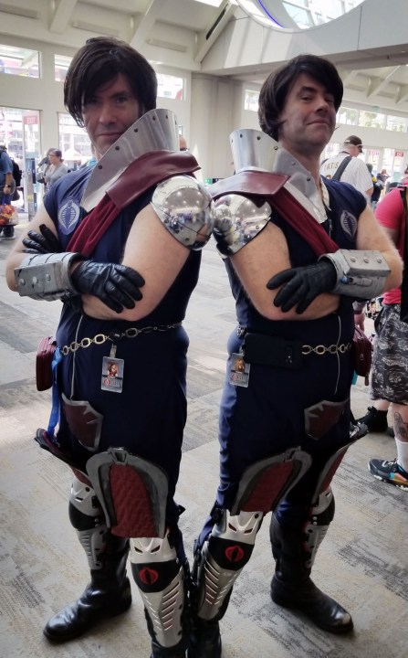 Two fans dressed as G.I. Joe villains Tomax and Xamot.