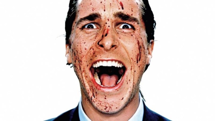 A bloody Christian Bale screams in American Psycho.