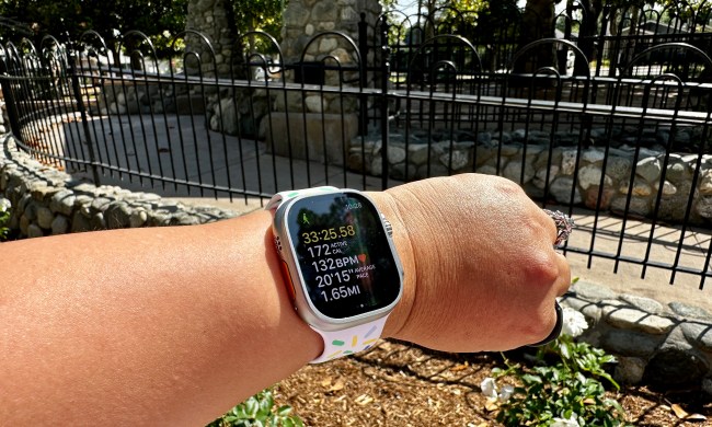 Apple Watch Ultra worn on wrist while doing an outdoor walk workout.