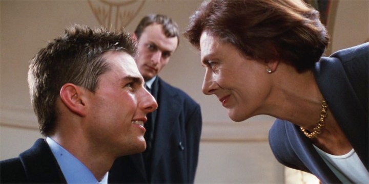 Vanessa Redgrave leans to look at Tom Cruise in Mission: Impossible.
