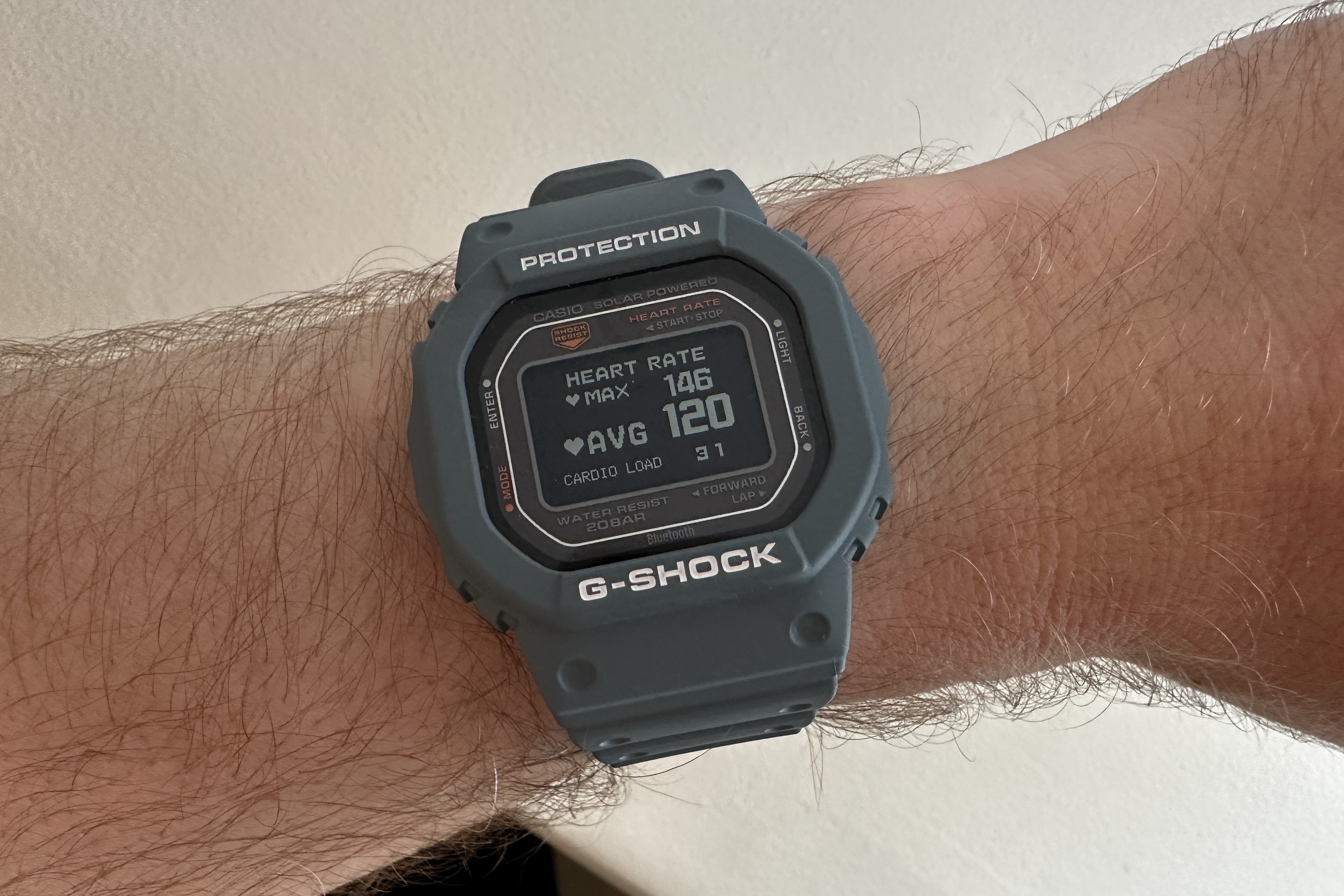 A person wearing the Casio G-Shock DW-H5600, showing workout heart rate data.