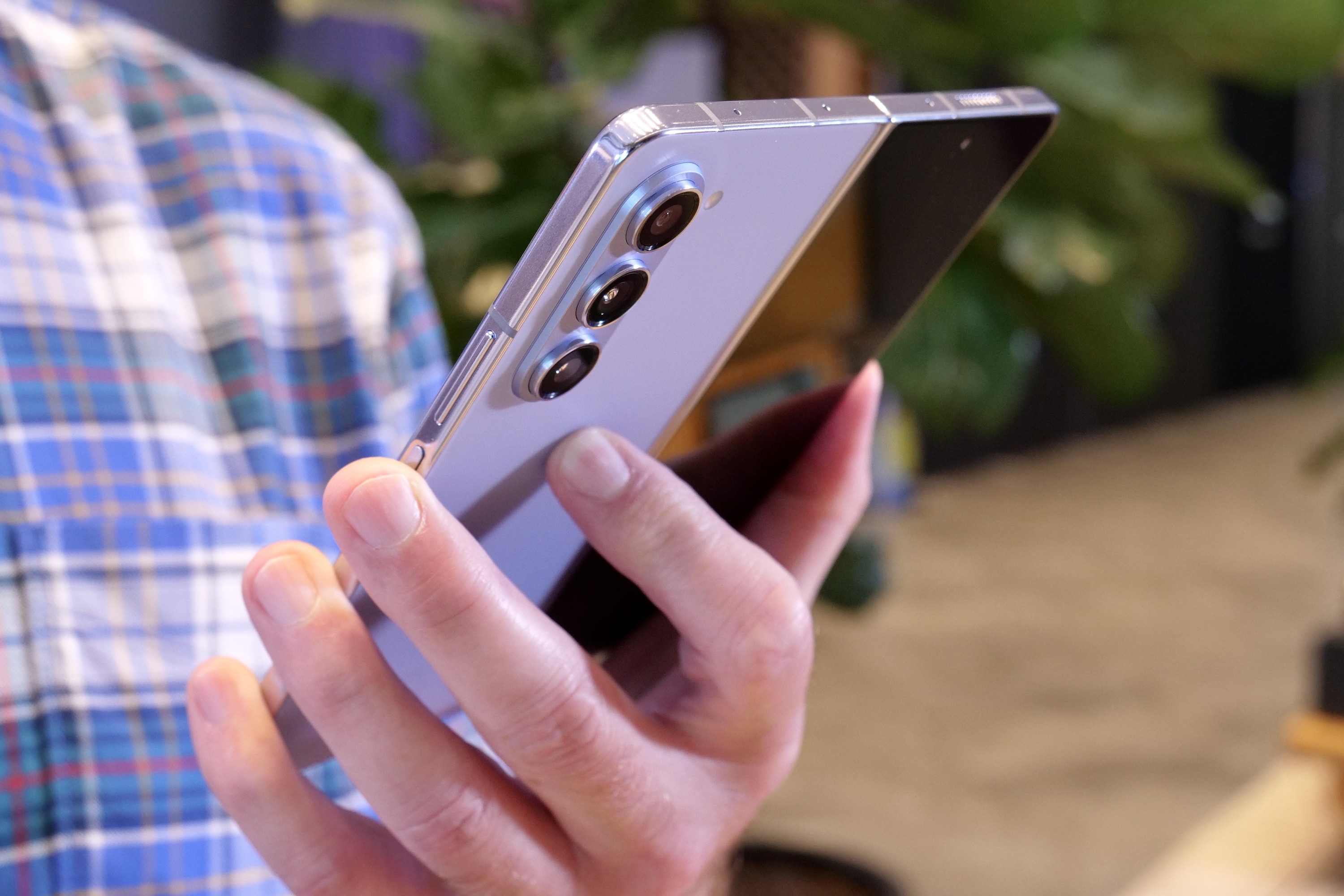 A person holding the Samsung Galaxy Z Fold 5.