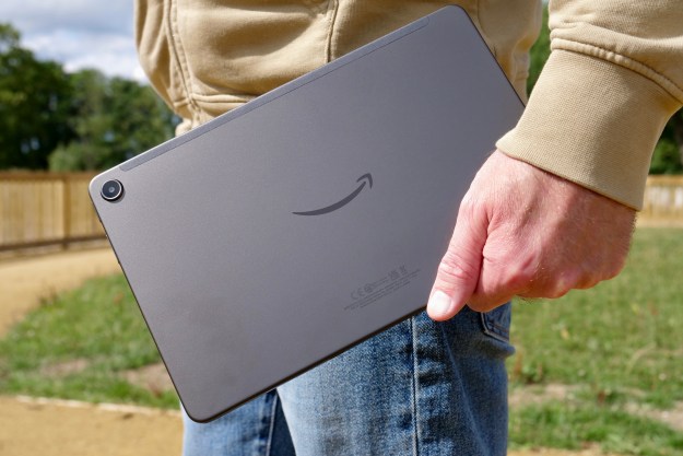 A person holding the Amazon Kindle Fire Max 11