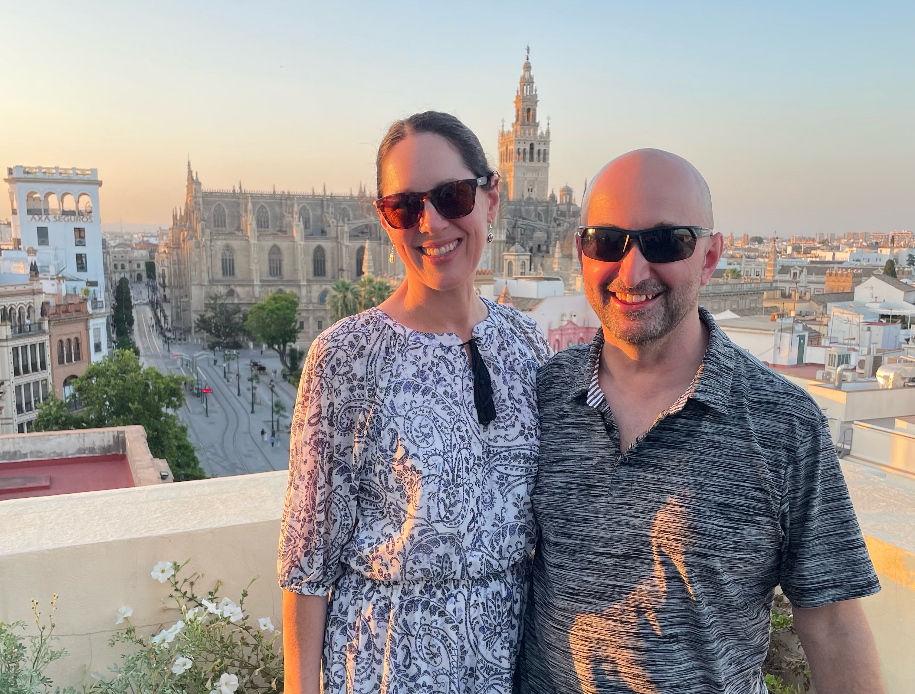 My wife Julie and I participated in a rooftop paella-cooking class during our time in Sevilla, Spain, last month. In the background is the Catedral de Sevilla. This photo was taken with Julie's iPhone 12 after I lost mine.