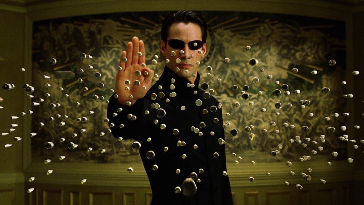 Keanu Reeves as Neo stopping dozens of oncoming bullets in The Matrix Reloaded.