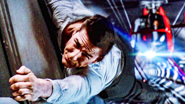 Tom Cruise holds on to a train in Mission: Impossible.
