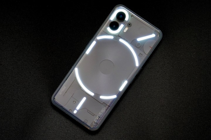 The back of the Nothing Phone 2 with the lights activated.