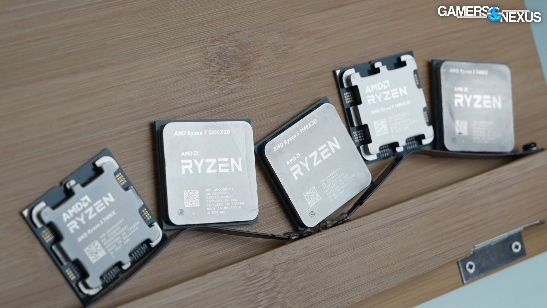 Several Ryzen chips next to each other, including the 5 5600X3D.