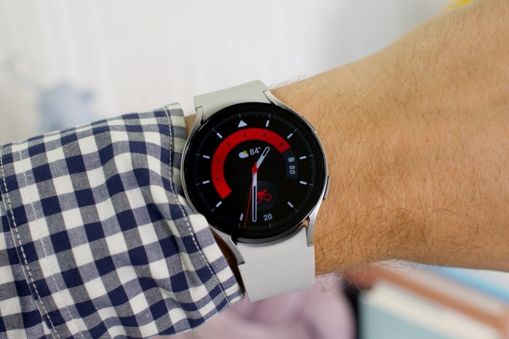 The Samsung Galaxy Watch 6 with a red and black watch face.