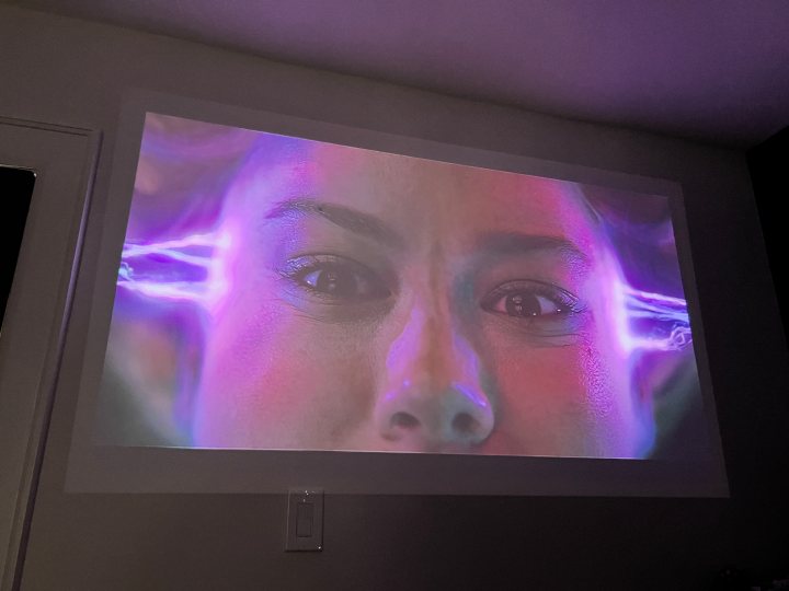 The image from the Xgimi Mo-Go 2 Pro featuring Captain Marvel in a room with some ambient light.