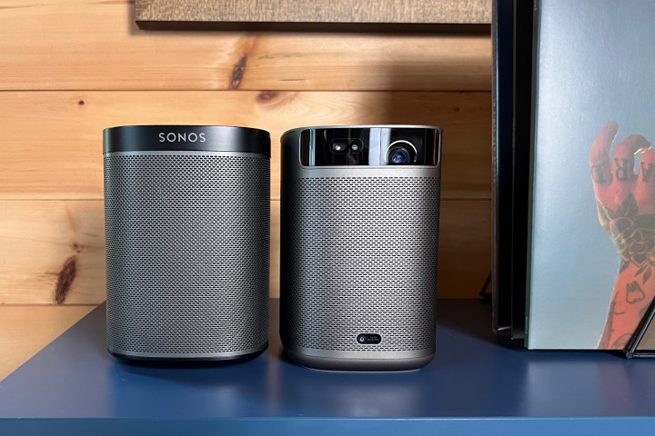 The Xgimi MpGo 2 Pro sitting alongside a Sonos Play:One speaker.