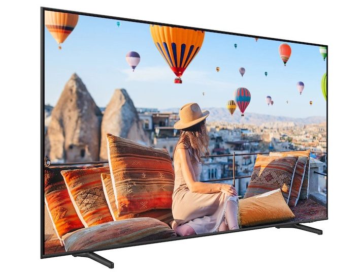 The 85-inch Class QE1C 4K Smart TV displaying a scene of hot air balloons, viewed at a side angle.