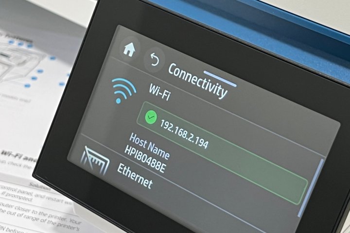 A printer's IP address is shown in menu settings.