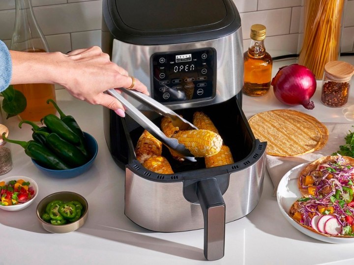 Removing some food from the Bella Pro Series .2-qt. digital air fryer.