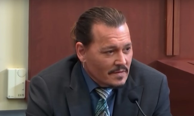 Johnny Depp sits on the stand in court in Depp v. Heard.