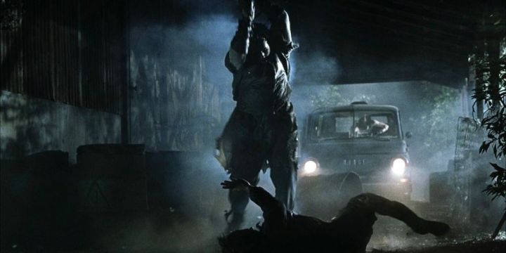Leatherface holds up his chainsaw before stabbing a victim