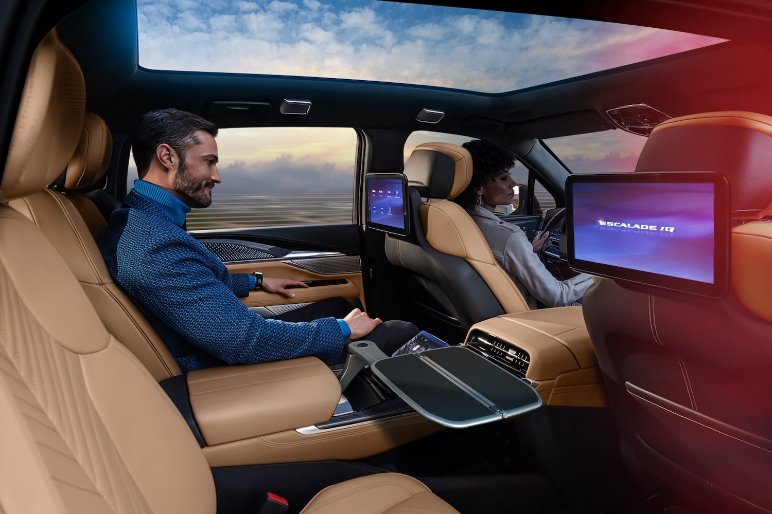 An important-looking person luxuriating in the second row of the 2025 Cadillac Escalade IQ.