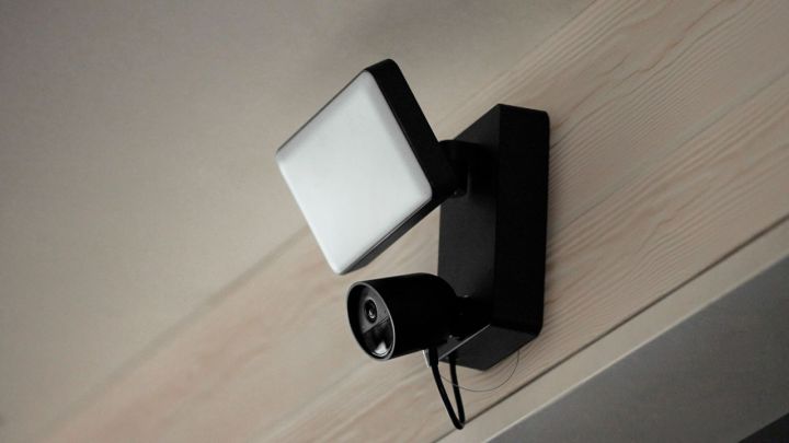 The Philips Hue Secure Floodlight installed on a building.