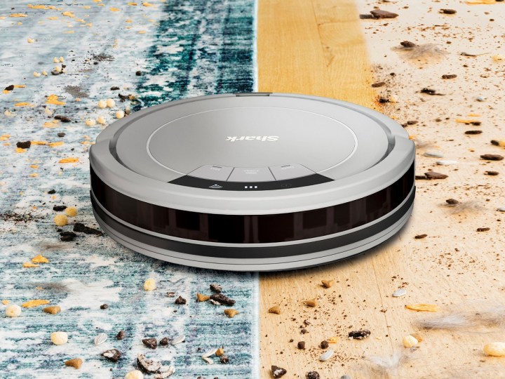 The Shark ION RV763 robot vacuum cleaning two types of floors.