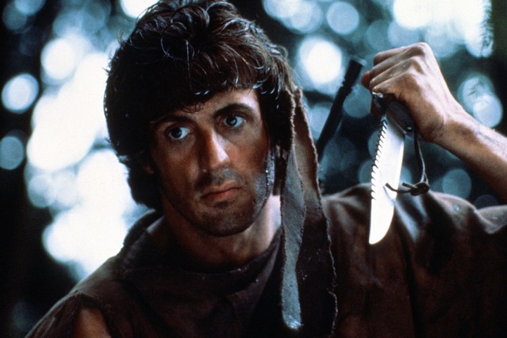 Sylvester Stallone holds a knife in First Blood.