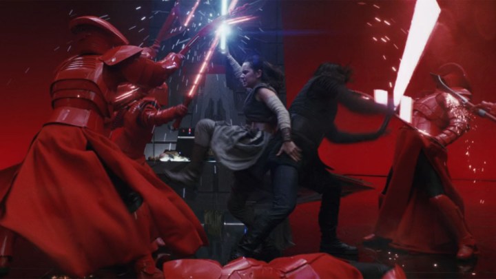 Rey and Kylo Ren fight back-to-back in The Last Jedi.