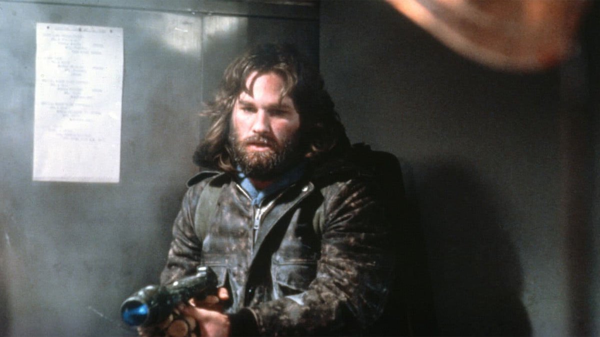 Kurt Russell points a gun in "The Thing."