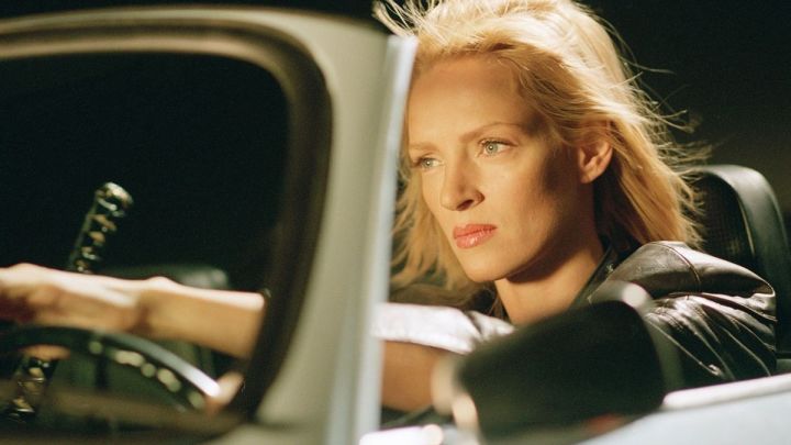 Uma Thurman as the Bride driving a car in the film Kill Bill: Volume 2.
