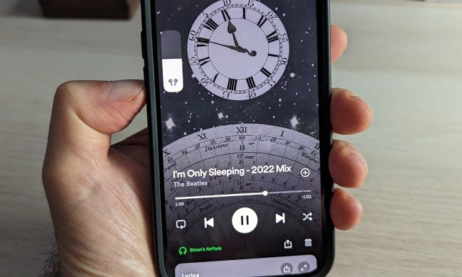 On-screen volume adjustment for AirPods using Spotify.