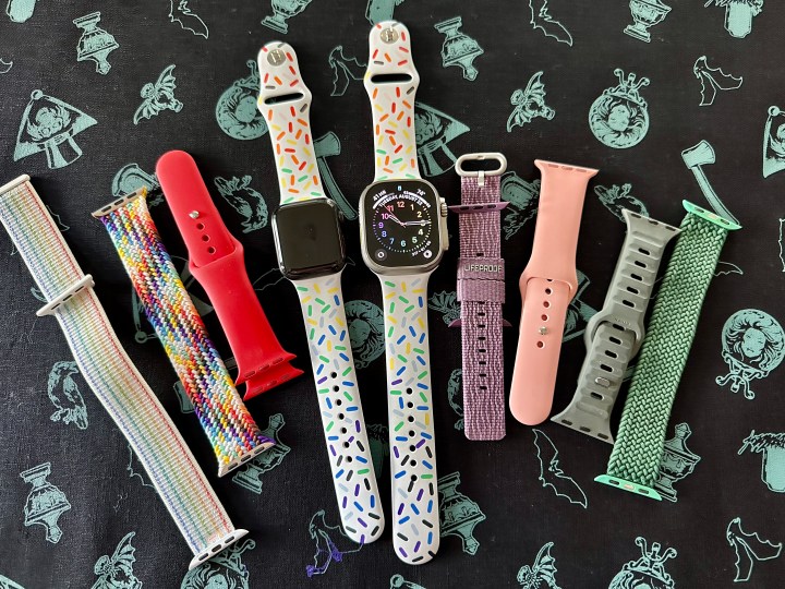 An Apple Watch Series 5 and an Apple Watch Ultra with an assortment of various Apple Watch bands.