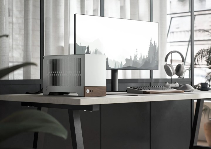 The Fractal Design Terra mini-ITX case in silver placed on a desk.