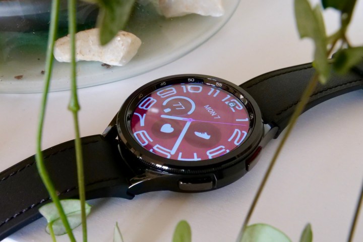 The Samsung Galaxy Watch 6 Classic showing a red watch face.