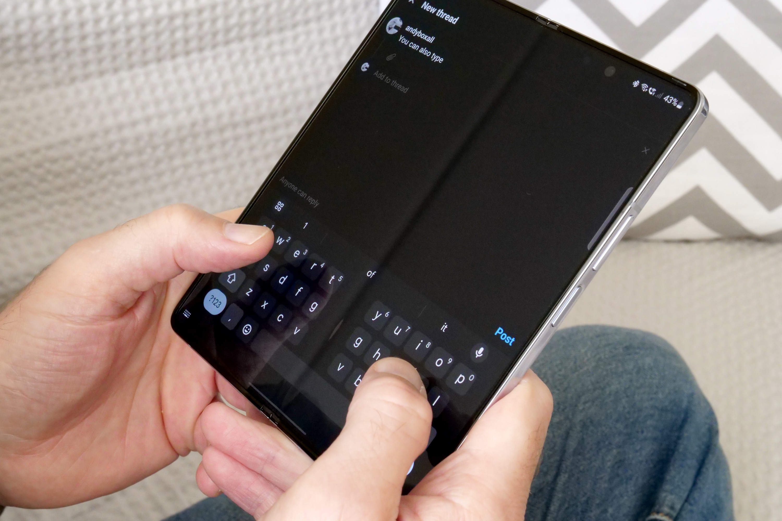 Typing on the Samsung Galaxy Z Fold 5's open screen.