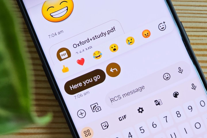 Emoji reactions on Google Messages running on OnePlus 11.