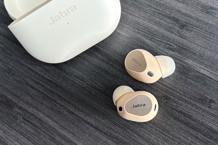 Jabra Elite 10 earbuds in front of case.
