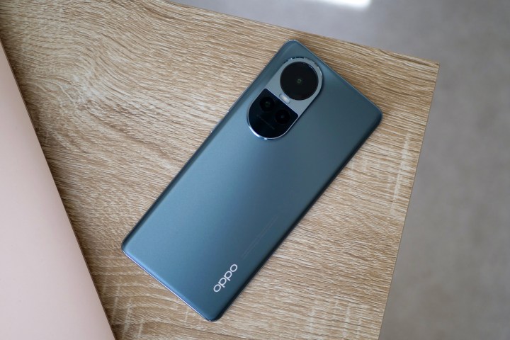 The back of the Oppo Reno10, resting on a desk.