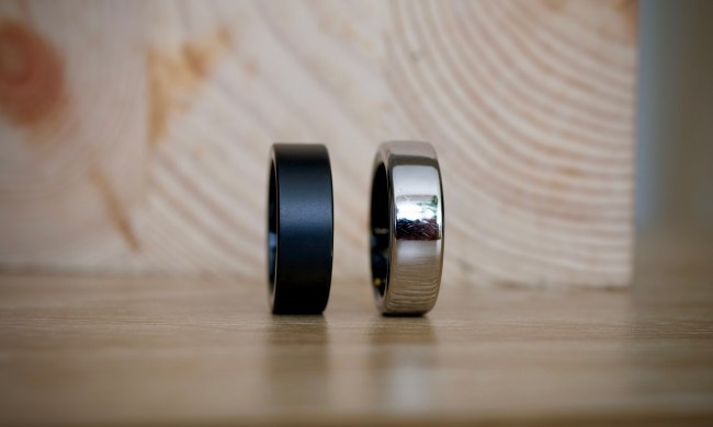 The Ultrahuman Ring Air and the Oura Ring, resting on a table.